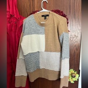 Block colored sweater, beige, white and grey.